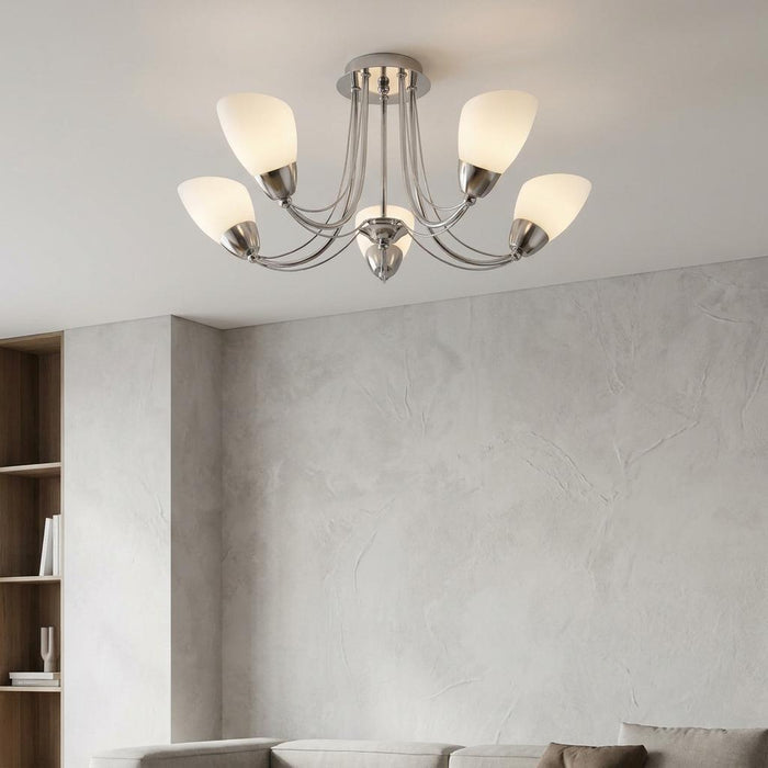 Altair 5 light chrome semi-flush ceiling light with white shades in a modern living room setting.
