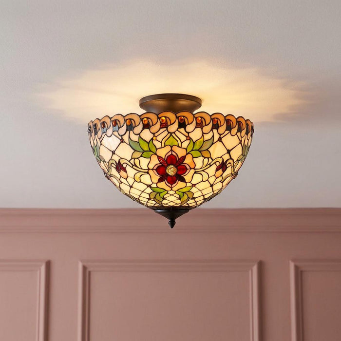 Tiffany-style semi-flush ceiling light with a floral stained glass shade, mounted above pink wall paneling.