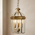 Antique brass domed 3-light lantern ceiling light with curved glass panels hanging from a chain.