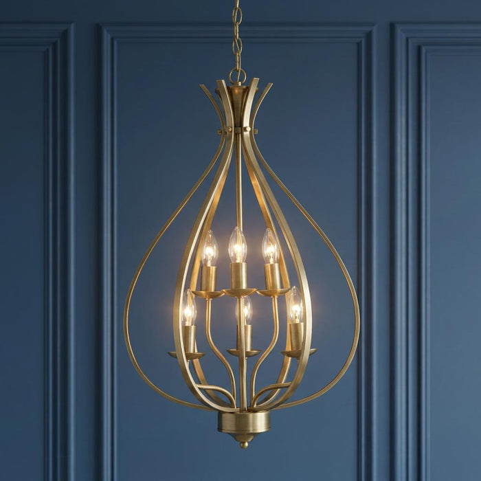 Araba 6-light antique brass pendant ceiling light with a teardrop cage design against a blue paneled wall.