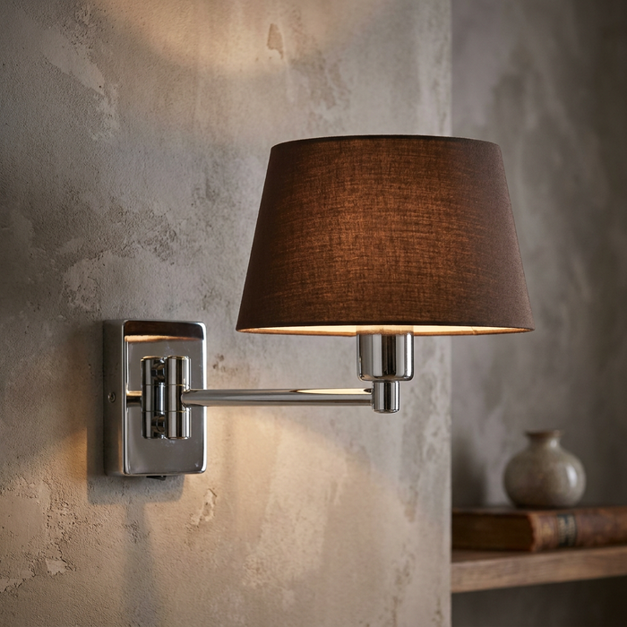 Armada Chrome Single Swing Arm Wall Light with a dark tapered shade mounted on a textured grey wall.