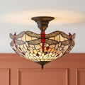 Beige Tiffany-style semi-flush ceiling light featuring red dragonfly designs and decorative glass jewels.
