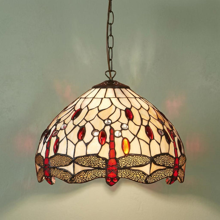 Tiffany pendant light with a beige glass shade featuring red dragonflies and colorful gems hanging from a chain.