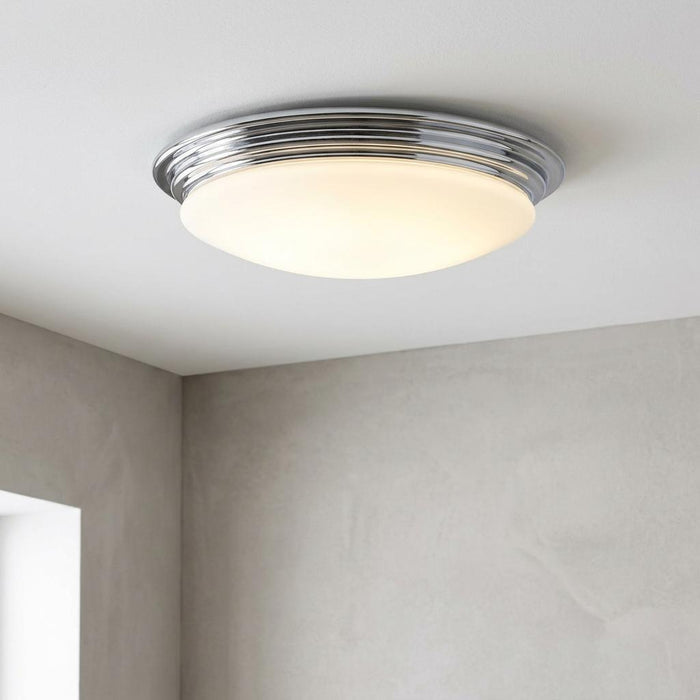 Brompton polished chrome flush LED ceiling light with frosted dome mounted on a white ceiling.