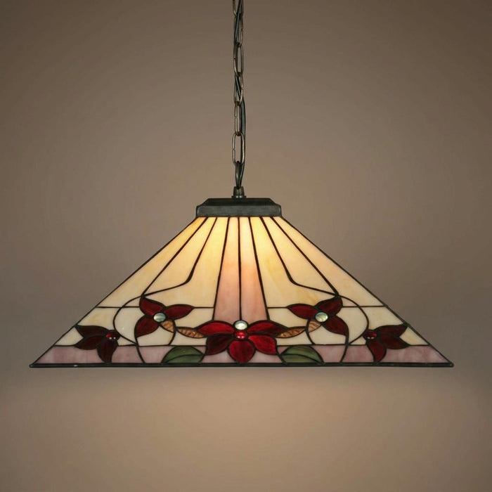 Tiffany-style pendant light with a triangular floral stained glass shade hanging from a bronze chain.