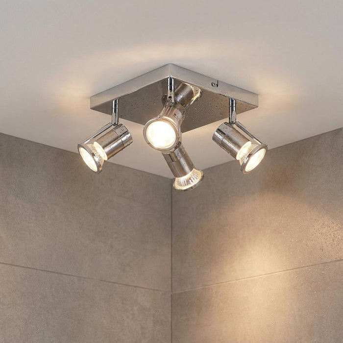Cara four-light chrome bathroom ceiling spotlight with adjustable glowing heads mounted on a square base.