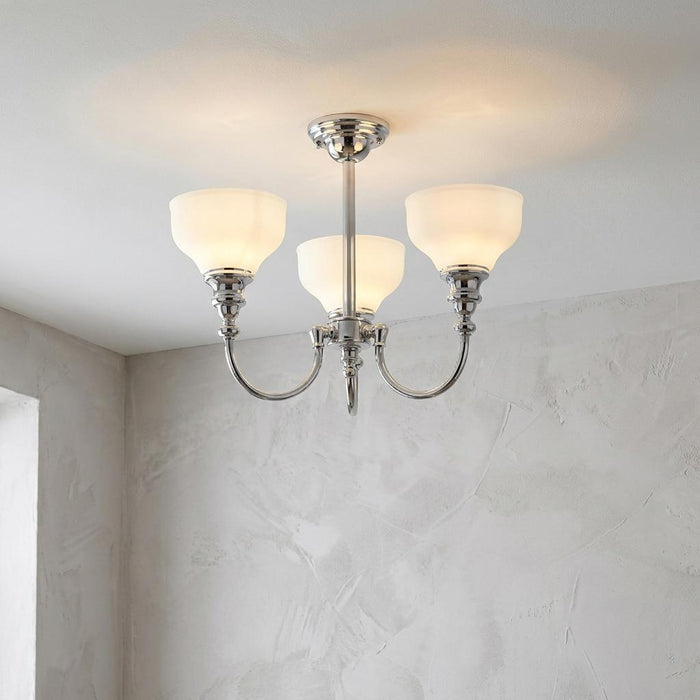 Cheadle chrome 3-light semi-flush ceiling fixture with opal glass shades mounted against a white ceiling.