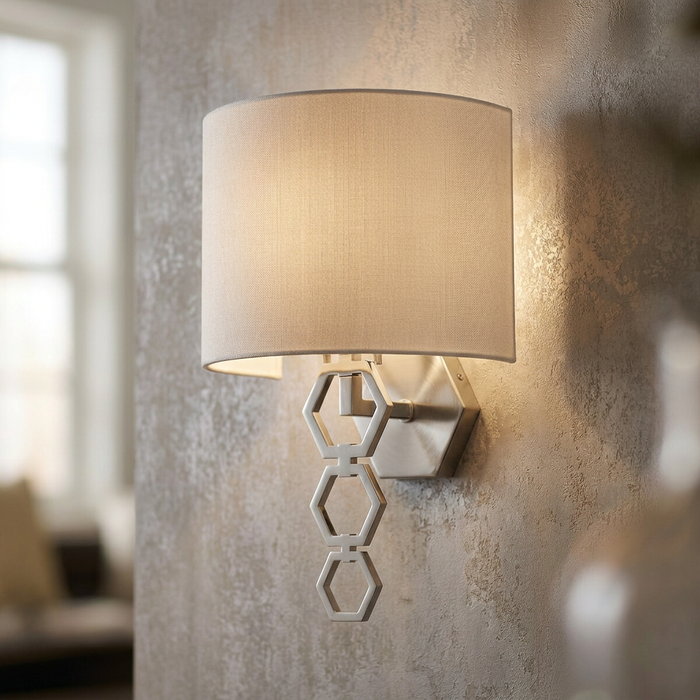 Clark wall light with a white fabric shade and polished chrome hexagonal accents mounted on a textured wall.