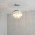 Modern bathroom pendant light featuring a clear glass dome and internal tiers of decorative glass tubes.