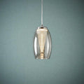 Cyclone 1 light ceiling pendant with a smoked glass shade and a glowing ribbed internal cone against a teal wall.