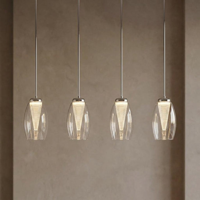 Four modern LED bar kitchen ceiling lights with clear glass shades and ribbed cones hanging against a neutral wall.