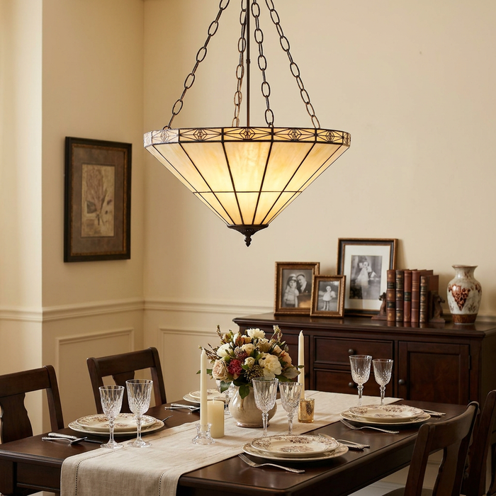 Large inverted Tiffany ceiling light with cream stained glass panels hanging above a formal dining room table.