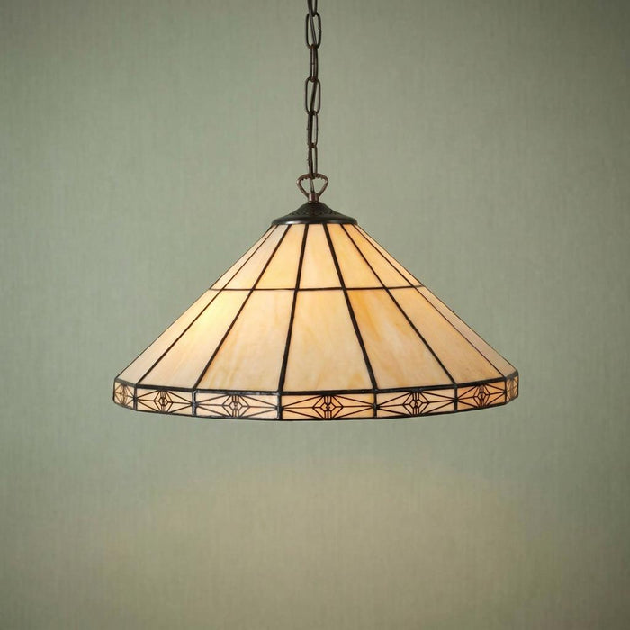 Dorchester Tiffany ceiling light with a cream glass conical shade and geometric rim, hanging from a chain.