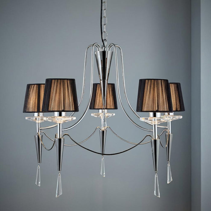Five-light chrome chandelier featuring black string shades and elegant crystal droplets against a grey background.