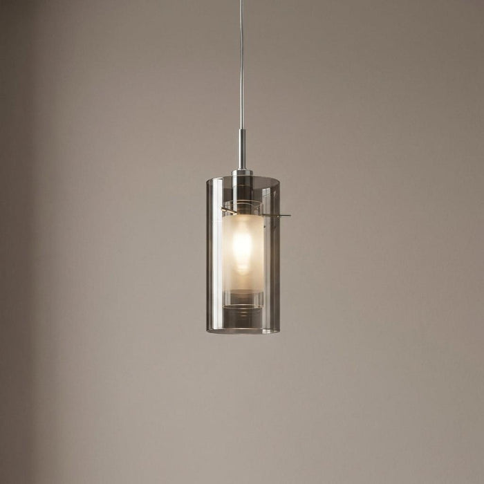 Modern ceiling pendant light with a smokey glass outer shade and a frosted inner cylinder.