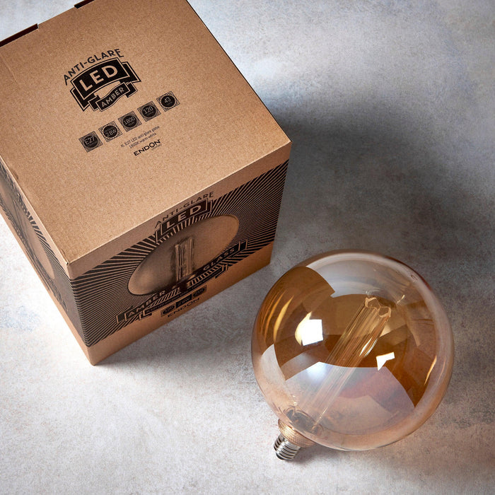 e27 globe internal cylinder amber led 2 8w light bulb 200mm Close Up Lit Image