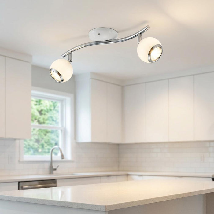 Eglo Bimeda 2-light white and chrome spotlight fixture mounted on a ceiling in a modern white kitchen.