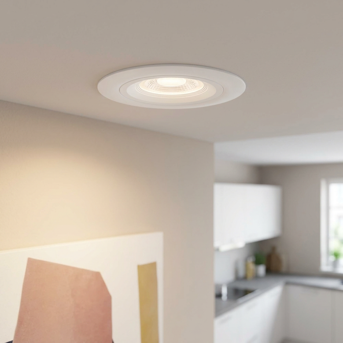 Eglo Calonge round white LED recessed spotlight providing warm illumination on a white ceiling.