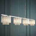 Elise 4-light chrome bar pendant with crystal cylinder shades and hanging drops against a teal paneled wall.