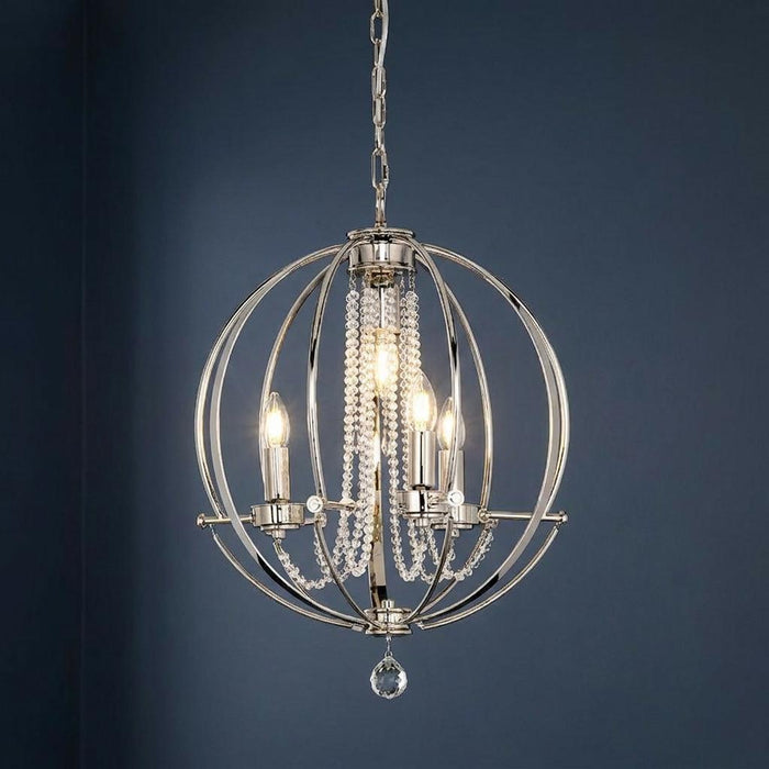 A polished nickel 4-light sphere chandelier with crystal bead strands, hanging against a dark blue background.