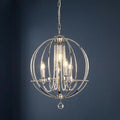 A polished nickel 4-light sphere chandelier with crystal bead strands, hanging against a dark blue background.