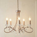 Elstead Christina 5-light chandelier in silver and gold leaf finish with crystal droplets and leaf accents.