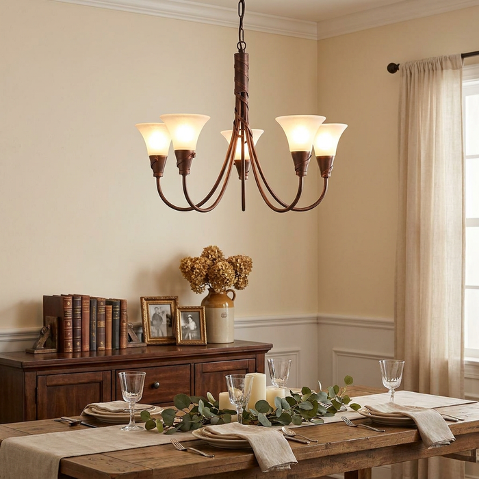 Elstead Emily 5-light copper chandelier with opal glass shades hanging over a rustic dining room table.