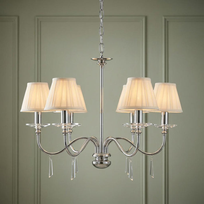 Elstead Finsbury Park 6-light polished nickel chandelier with pleated cream shades and crystal droplets.