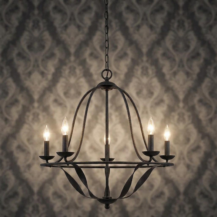 Five-light grey metal chandelier with curved cage arms and lit candle bulbs against a damask wallpaper background.