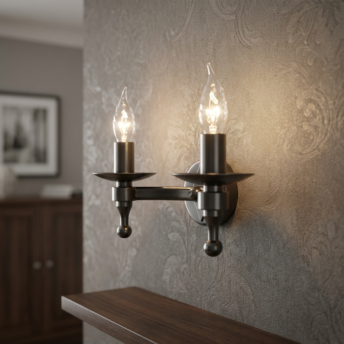 Elstead Lighting Warwick 2 Wall Light with two candle bulbs mounted on a textured, patterned wallpaper.