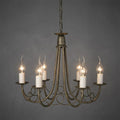Traditional six-arm black and gold chandelier with elegant scroll details and glowing candle-style bulbs.