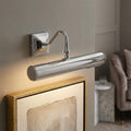 Polished chrome 2 light picture light with a curved arm illuminating a framed artwork on a neutral wall.