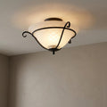Elstead Torchiere black flush ceiling light with opal glass bowl and scroll metalwork detail.