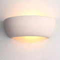 eton unglazed ceramic wall light by Endon Lighting Living room close up image