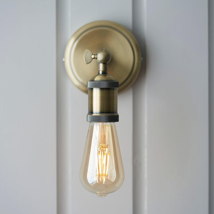 hal brass finish wall light 1 by Endon Lighting Bedroom Close Up Image