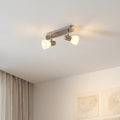 Eglo Enea 2-light bar spotlight with nickel finish and white satin glass shades, mounted on a white ceiling.