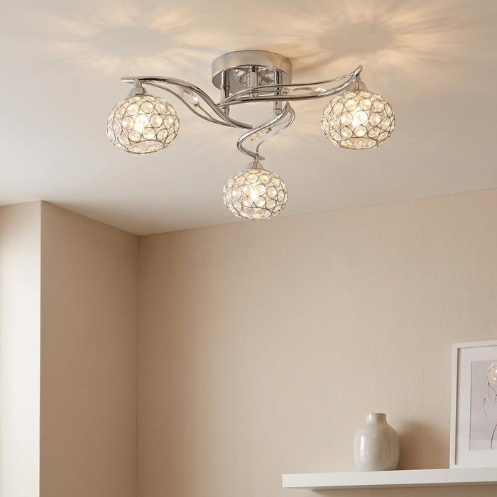 Esmee 3 Light Chrome Flush Ceiling Light with crystal beaded globe shades mounted on a neutral ceiling.