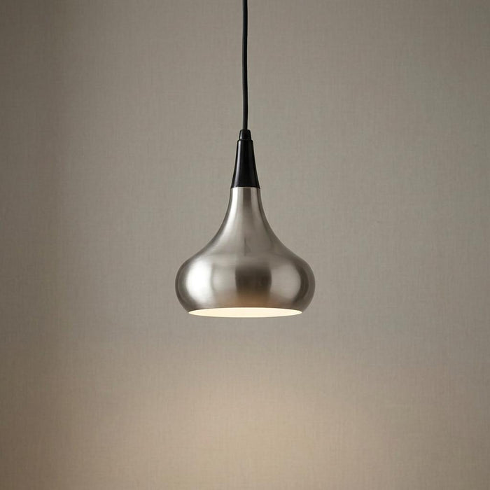 Illuminated brushed steel teardrop pendant light with a black cord against a neutral background.