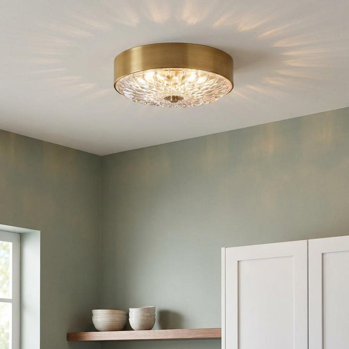 Feiss Botanic 3-light brass flush ceiling light with a textured glass diffuser on a white ceiling in a green room.