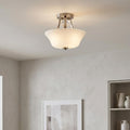 Feiss Evington satin nickel semi-flush ceiling light with a glowing white glass shade in a modern room.