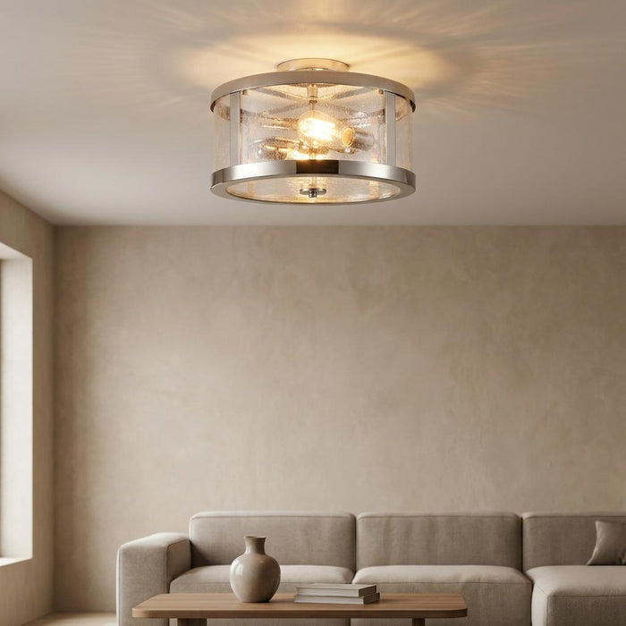 Feiss Harrow 2 light semi flush polished nickel ceiling light with seeded glass above a beige sofa.