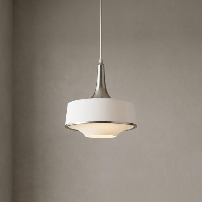 Feiss Holloway white and brushed steel pendant light with a glowing glass diffuser against a plain wall.