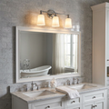 Feiss Huguenot Lake 3-light chrome wall fixture with opal glass shades mounted above a large bathroom mirror.