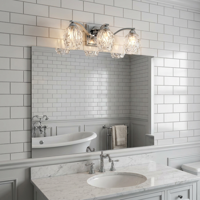Feiss Kalli 3-light chrome vanity fixture with crystal glass shades above a mirror in a subway-tiled bathroom.
