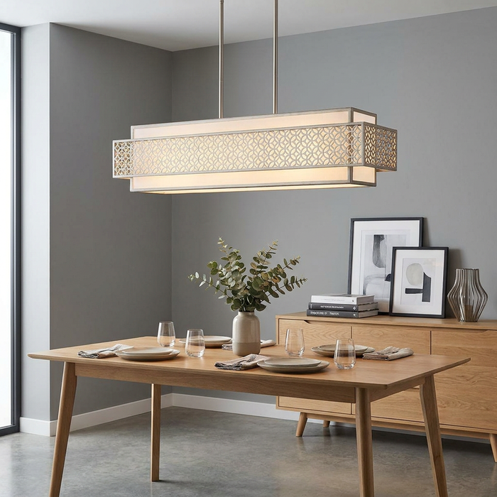 Silver island chandelier with a geometric lattice pattern hanging above a wooden dining table in a modern home.