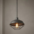 Industrial slated grey pendant light with a textured metal dome and wire cage shade featuring an Edison bulb.