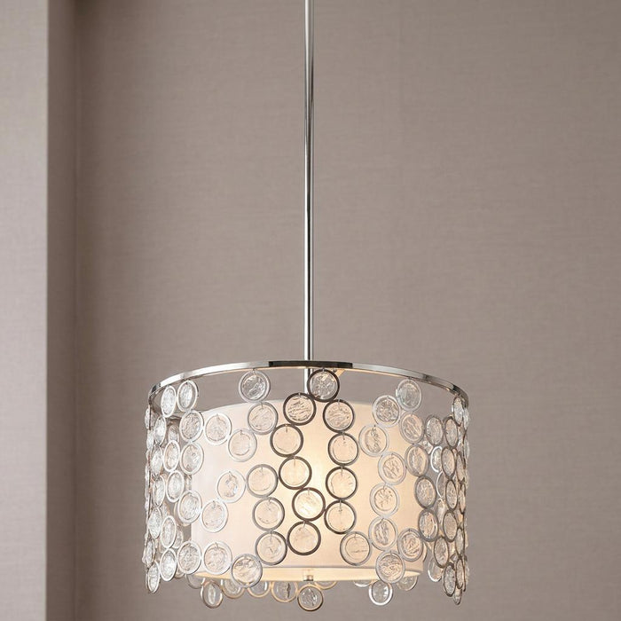 Polished nickel pendant light with a white fabric drum shade and decorative circular glass accents.