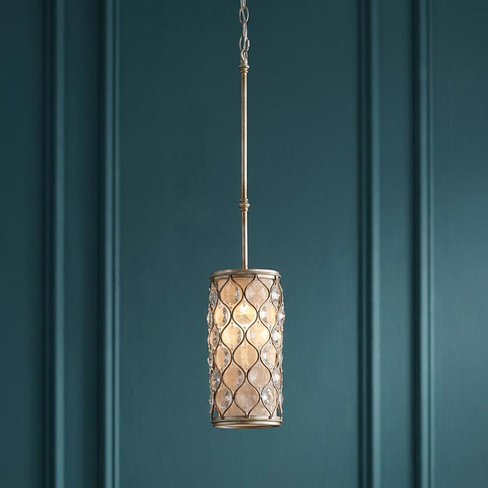 Feiss Lucia silver and crystal mini pendant light hanging against a dark teal paneled wall.