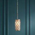 Feiss Lucia silver and crystal mini pendant light hanging against a dark teal paneled wall.
