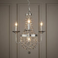Polished nickel 3-light chandelier with cascading crystal beads against a neutral paneled wall.